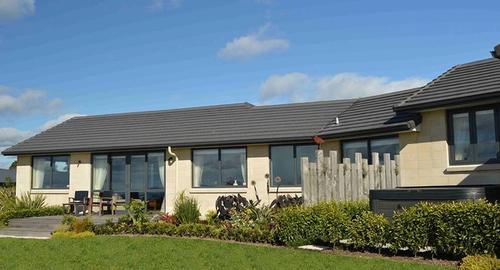 Spa Area Now created a private spa area with a sculptured fence and fragrant hedging to large deck area