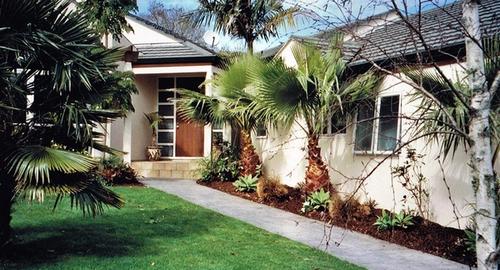 Front Entrance Removing or thinning out existing plants creates a lighter more welcoming entrance.