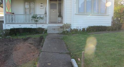 Front Yard Want a flat lawn but live on a slope and want a feature.