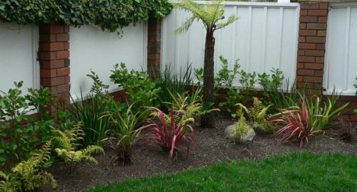 Create movement and colour with planting. Rocks add a solidness and help with moisture in the ground.