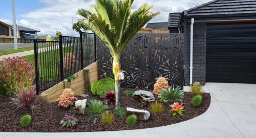 A screen as a backdrop creates a garden & utility area