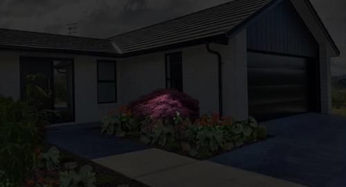 Front Garage Side of House Lighting up the maple trees at night creates a soft welcoming entry