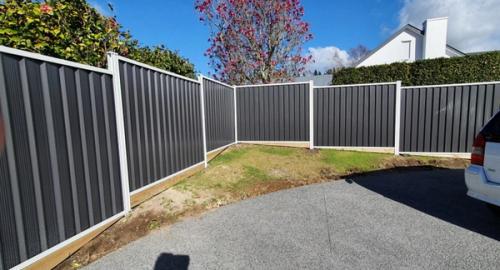 A small triangle garden area that requires a low maintenance garden