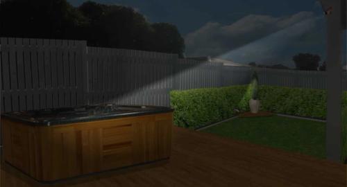 Lighting this area now becomes a lovely place to be with a feature pot and plant in the corner of the garden and another light on the spa.