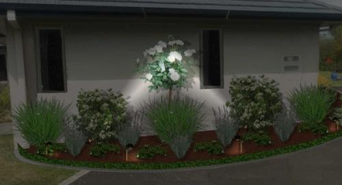 Side of house after using landscape imaging showing night lighting. This creates interest and added security to the house.