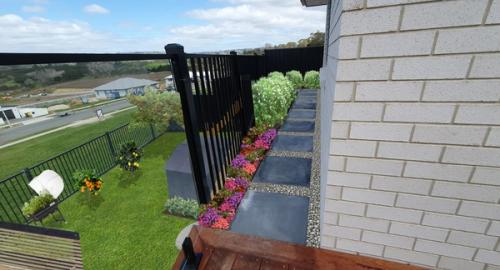 Soften area with annuals, small hedge and stones around pavers