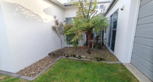 A feature garden that has potential but lacks life.